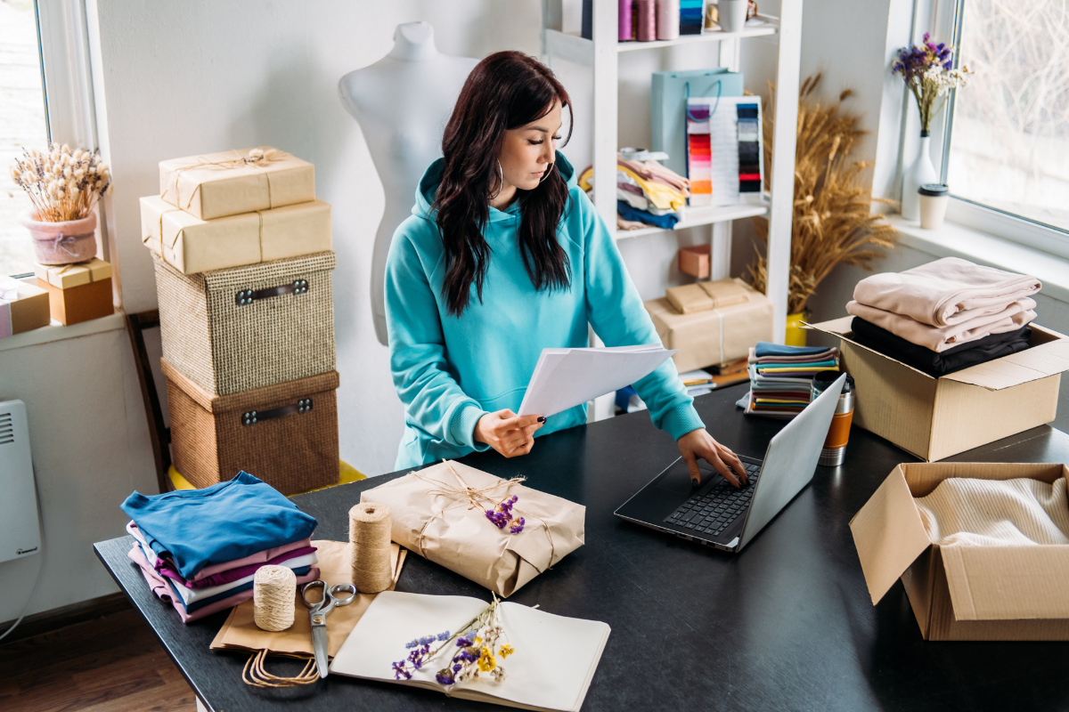 Female entrepreneur doing some online marketing for her ecommerce store on a laptop.